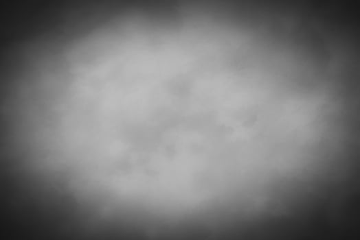 Blured gray decorative plaster or concrete background with vignette. photo