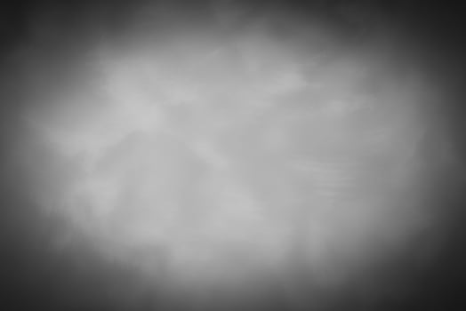 Blured gray decorative plaster or concrete background with vignette. photo