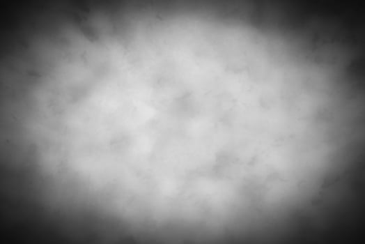 Gray decorative plaster or concrete background with vignette. photo