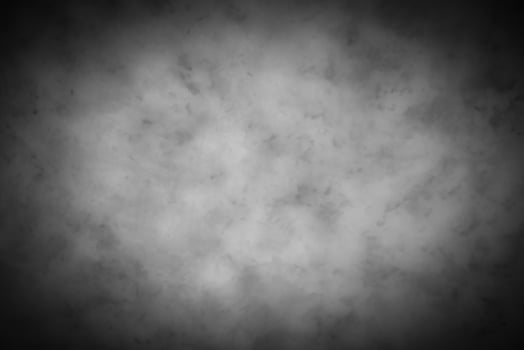 Gray decorative plaster or concrete background with vignette. photo