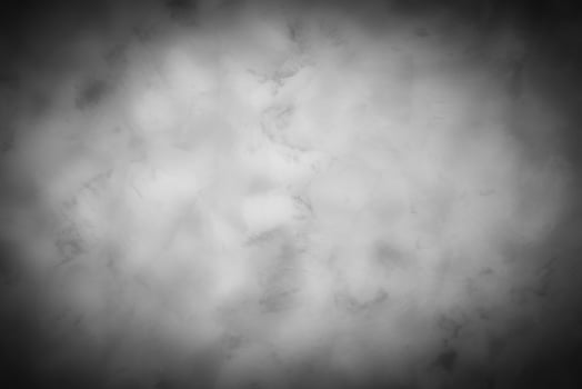 Gray decorative plaster or concrete background with vignette. photo
