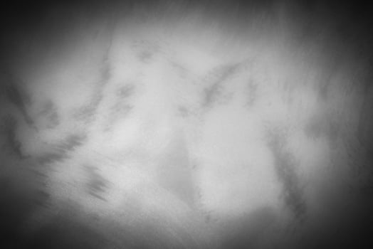 Gray decorative plaster or concrete background with vignette. photo