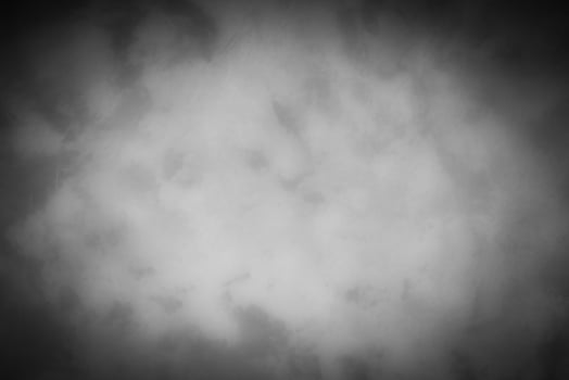 Gray decorative plaster or concrete background with vignette. photo