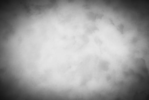 Gray decorative plaster or concrete background with vignette. photo
