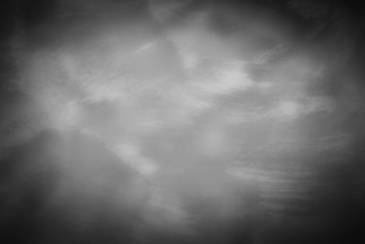 Gray decorative plaster or concrete background with vignette. photo