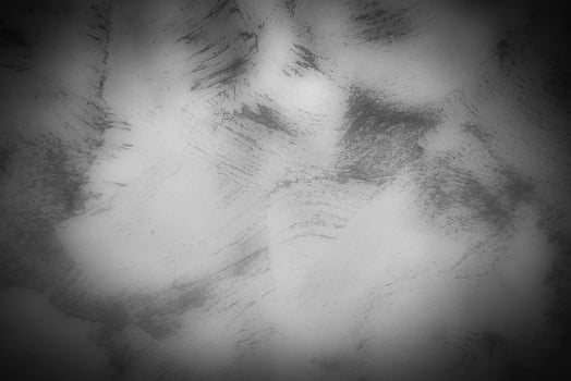 Gray decorative plaster or concrete background with vignette. photo