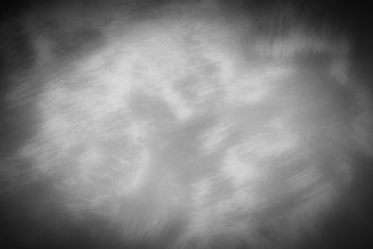 Gray decorative plaster or concrete background with vignette. photo