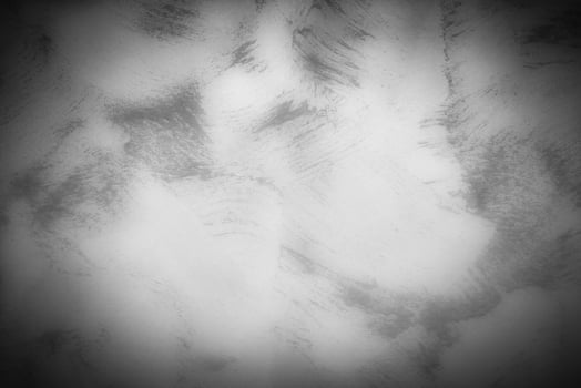 Gray decorative plaster or concrete background with vignette. photo