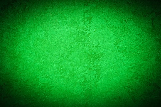 Texture of green decorative plaster or concrete with vignette. photo