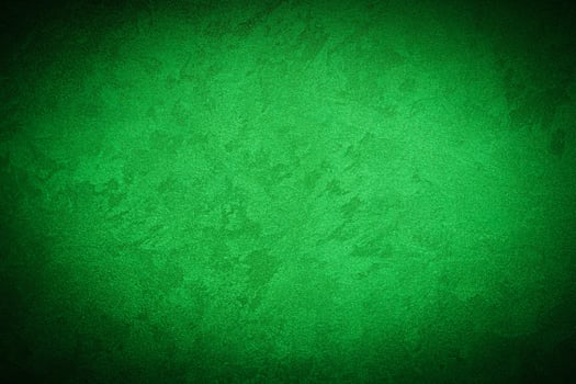 Texture of green decorative plaster or concrete with vignette. photo