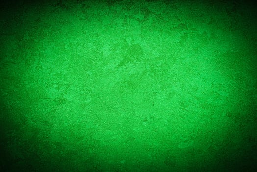 Texture of green decorative plaster or concrete with vignette. photo