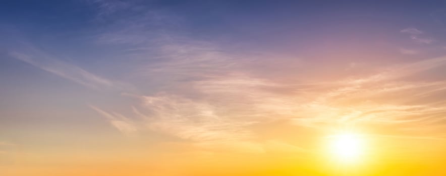 Colorful dramatic clouds lit by a sun against the sunset or sunrise sky. photo