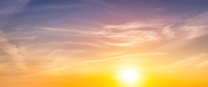 Colorful dramatic clouds lit by a sun against the sunset or sunrise sky. photo
