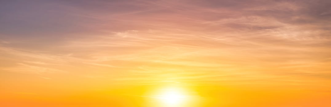 Colorful dramatic clouds lit by a sun against the sunset or sunrise sky. photo