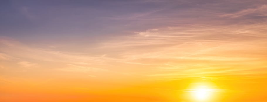 Colorful dramatic clouds lit by a sun against the sunset or sunrise sky. photo