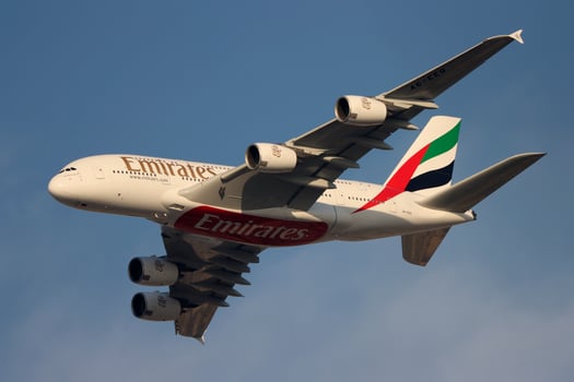 airbus a 380 emirates flying in blue sky photo