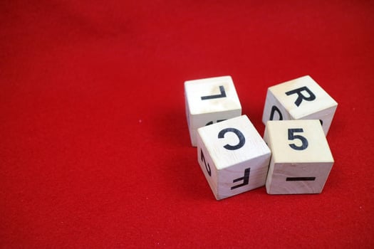 Educational stacking cube toy made of wood with numbers and letters photo