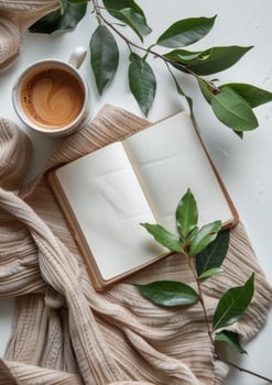 Coffee Cup and Book on Bed photo