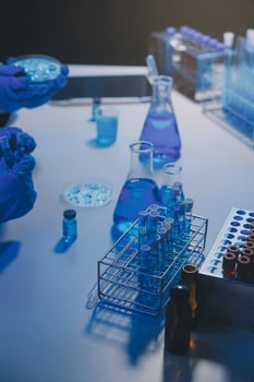 chemist,scientist hand dropping chemical liquid into test tube, science research and development concept photo