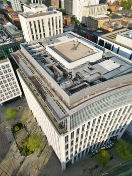 High Angle View of Greater Manchester City Centre Buildings During Beautiful Sunny day over England UK. May 5th, 2024 photo
