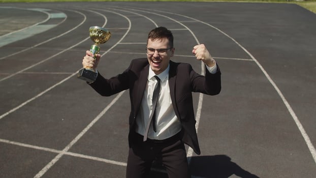 Top View Of The Winning Corporate Business Man In An Office Suite With A Cup In photo