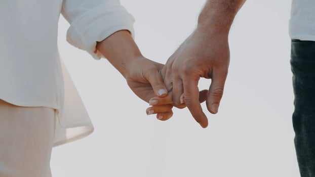 Close-Up As White Man And A Woman In Love Tenderly Holding Hands. photo