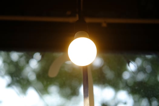 Light bulb hanging and decorated shining in cafe and house photo