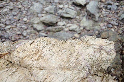 Sea wave with beach pebble and rock stone photo