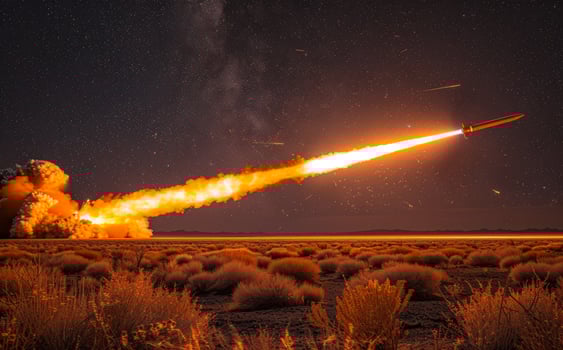 Rocket launches into the sky. A missile launch at night photo