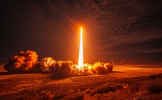 Rocket launches into the sky. A missile launch at night photo