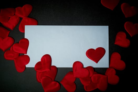 Valentine's day,a Declaration of love.White envelope with red hearts. Valentine. On a dark gray background. photo