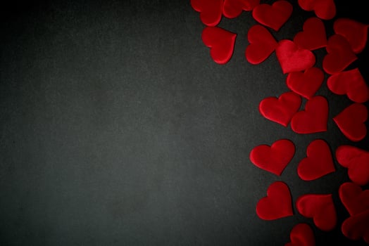 Valentine's day,a Declaration of love.Lots of red hearts on a dark graphite background. photo