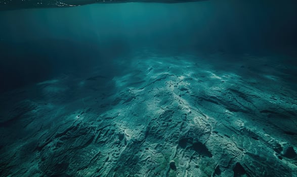 underwater scene with sun rays and seafloor photo