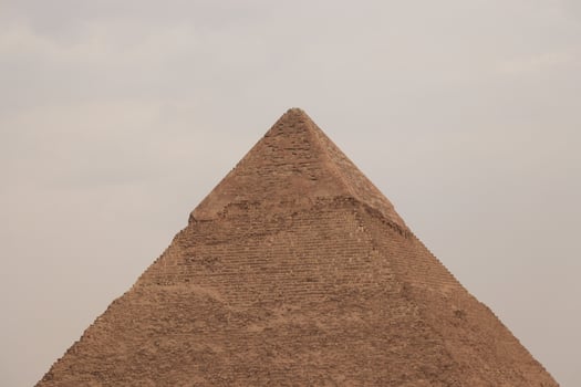 the pyramids of egypt , the pyramid of khufu is the largest pyramid in giza governorate photo