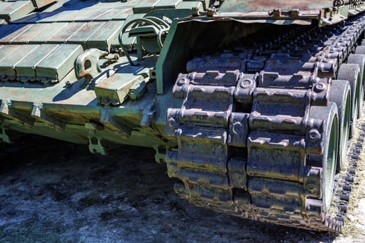 tracks and wheels of tank t80, armored vehicles on the street in green khaki color photo