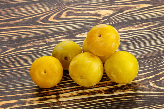 Yellow sweet plum heap fruit photo