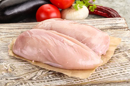 Raw chicken breast for cooking photo