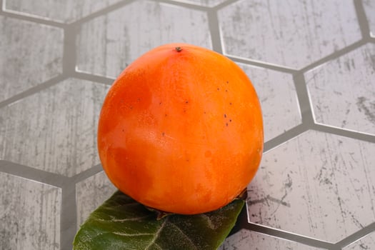 Fresh ripe sweet juicy persimmon photo