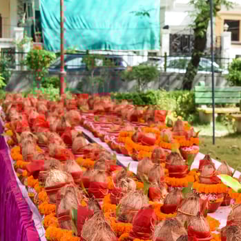 Kalash with coconut and mango leaf with floral decoration earthen pots containing sacred water. Kalash for hindu puja during Jagannath Temple Mangal Kalash Yatra, front view, closeup photo