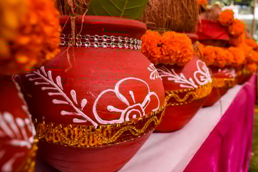 Kalash with coconut and mango leaf with floral decoration earthen pots containing sacred water. Kalash for hindu puja during Jagannath Temple Mangal Kalash Yatra, front view, closeup photo