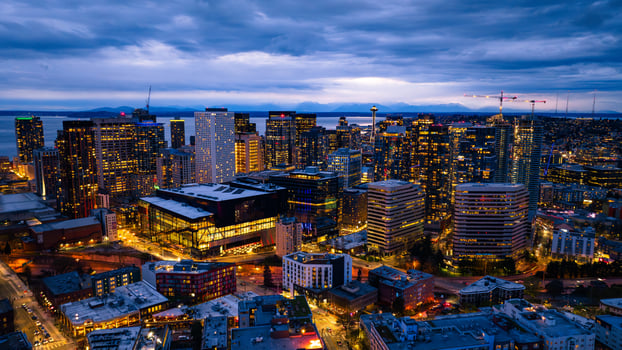 Splendid scenery of the vibrant downtown of Seattle, Washington, the USA. Blue waterscape and evening night at backdrop. photo