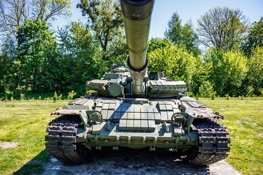 tank t80, armored vehicles with dynamic protection unit on street in green khaki color photo
