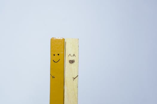 Closeup of wooden sticks With Happy Smiling Face, Friendship, Family, Group, Teamwork, Community, Unity, Love Concept. photo