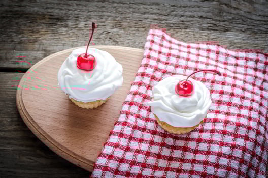Cupcakes with whipped cream photo