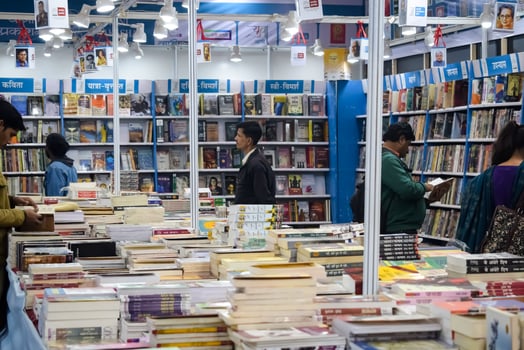 New Delhi, India, May 7 2024 - Variety of Books on shelf inside a book-stall at Delhi International Book Fair, Selection of books on display in Annual Book Fair at Bharat Mandapam complex photo