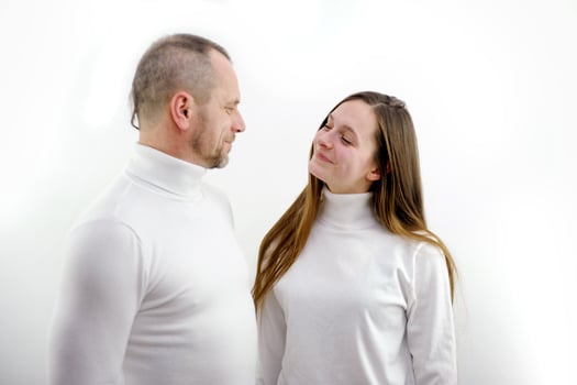 The couple cuddles on a white background. Lovers photo
