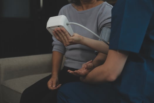 Doctor doing professional pressure examine her young patient photo