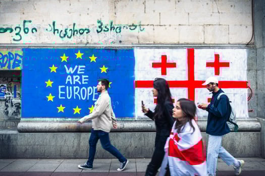 Tbilisi, Georgia - 16th may, 2024 - Eu and Georgian flag on wall, statement - we are EUROPE. No russian law movement. Integration process to EU concept photo