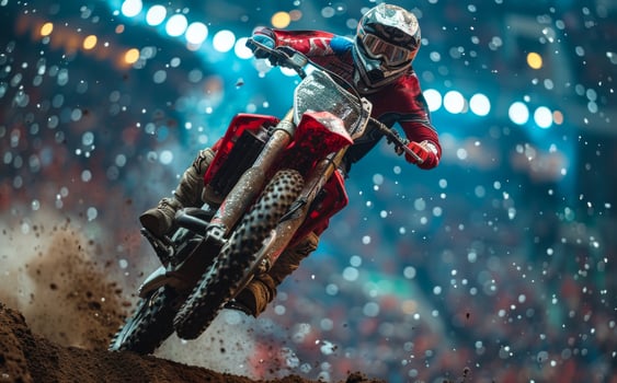 Racer on mountain bike jumps and takes off the ground motocross championship photo