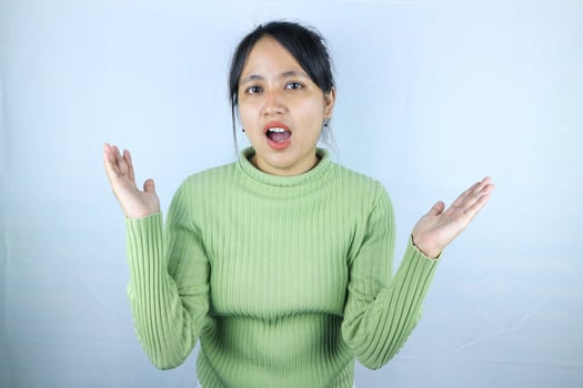 Surprised happy beauty asian woman looking camera in excitement with mouth open facial expression photo